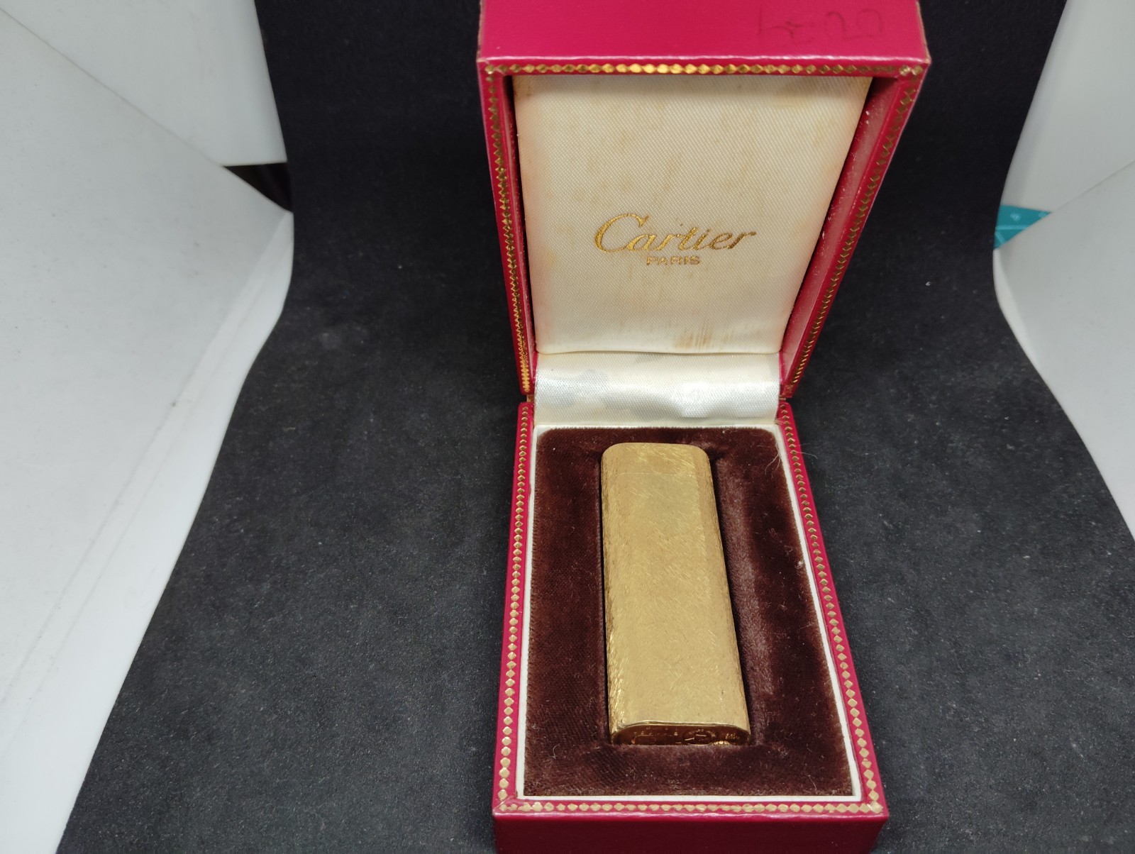 Vintage Cartier gas lighter Gold with an all-over pattern oval with box. Vintage Cartier gas lighter Gold with an all-over pattern oval with box.