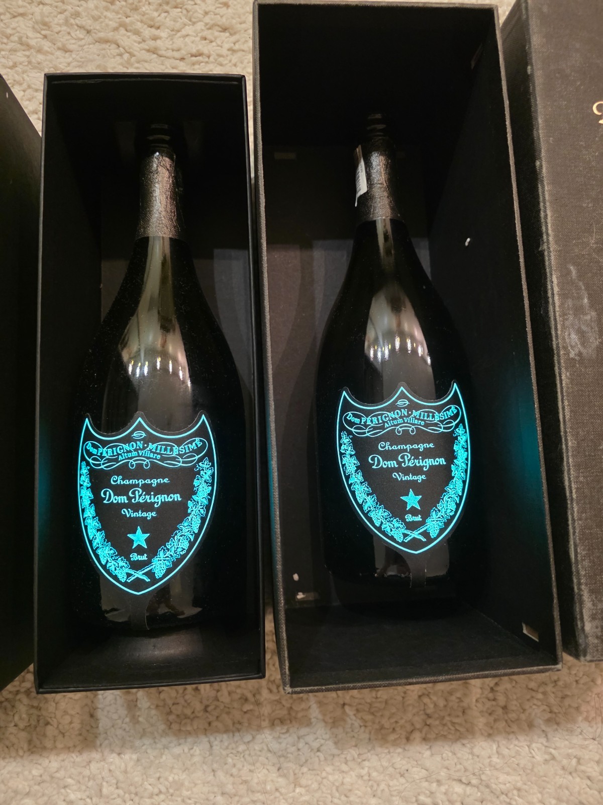 Dom Pérignon. Luminous Collection A glowing empty bottle with a box.
