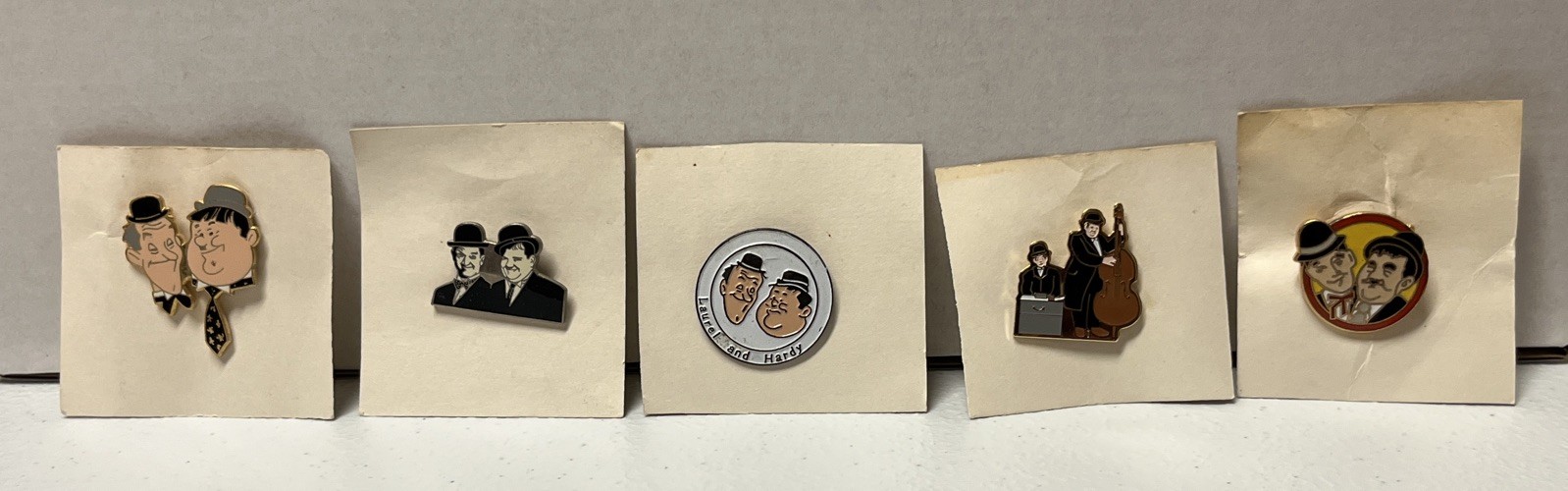 Group Of 5 Different Vintage Laurel and Hardy Enamel Lapel Pin NOS Group Of 5 Different Vintage Laurel and Hardy Enamel Lapel Pin NOS
