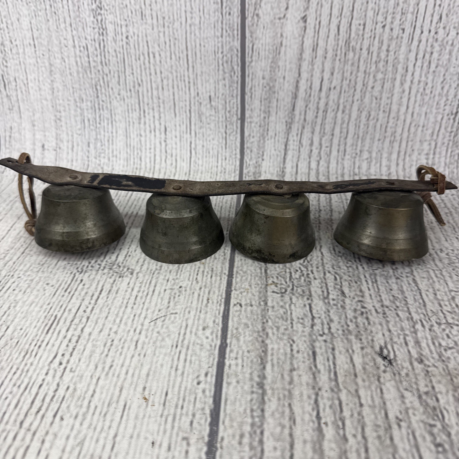 Atq./Vtg.  Graduated 4 bells on  13” strap General Store Door /Sleigh/ Carriage