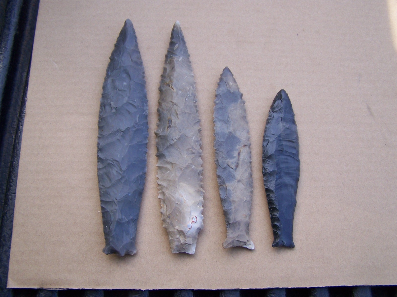 Here is a group of 4 reproduction arrowheads (Read listing) Here is a group of 4 reproduction arrowheads (Read listing)