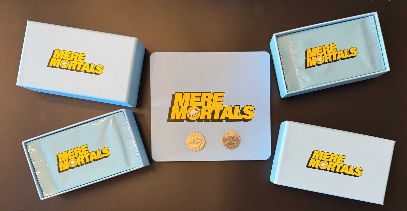 2 Sealed Mere Mortals Boxes + Coins + Chart/Rules – 25 Cards Each Box 2 Sealed Mere Mortals Boxes + Coins + Chart/Rules – 25 Cards Each Box