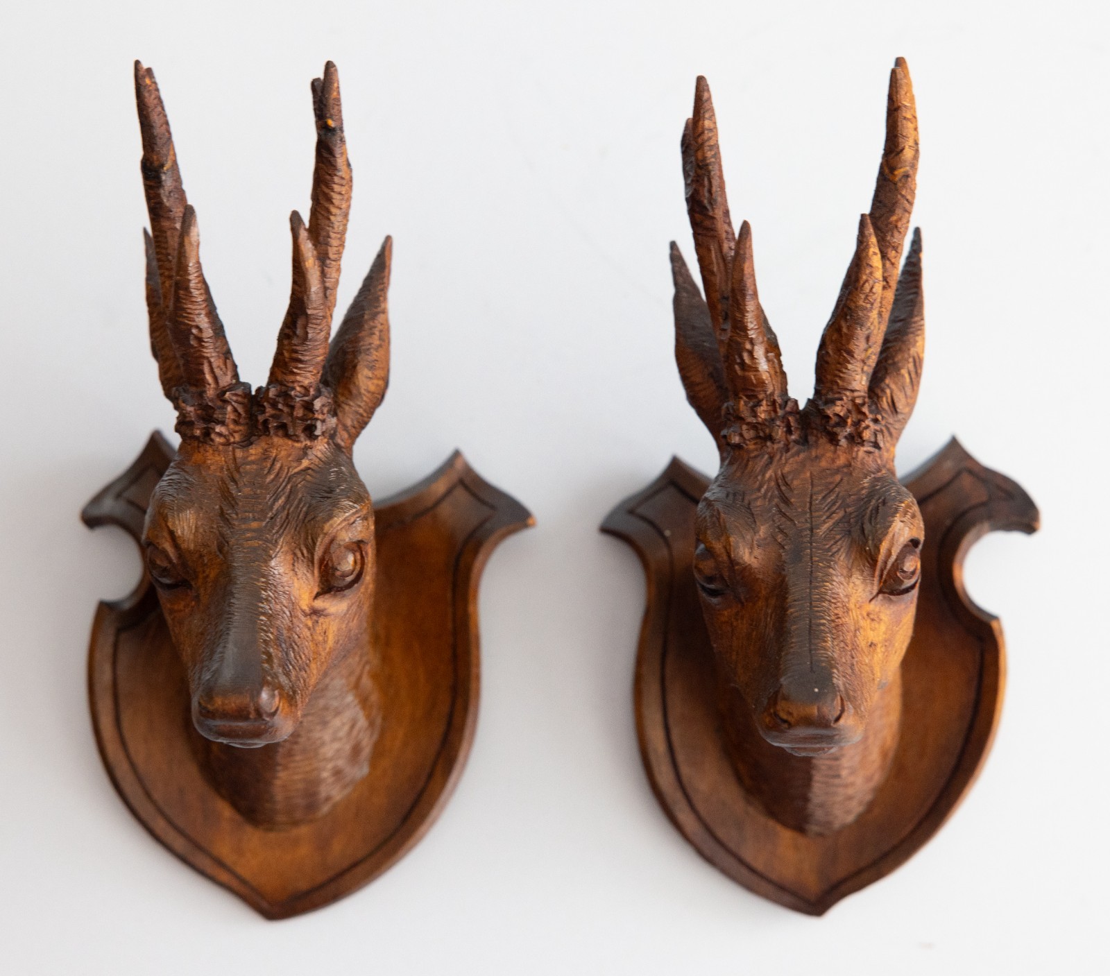 Pair of Antique Black Forest Carved Deer Head Trophy Plaques, Circa 1900 Pair of Antique Black Forest Carved Deer Head Trophy Plaques, Circa 1900