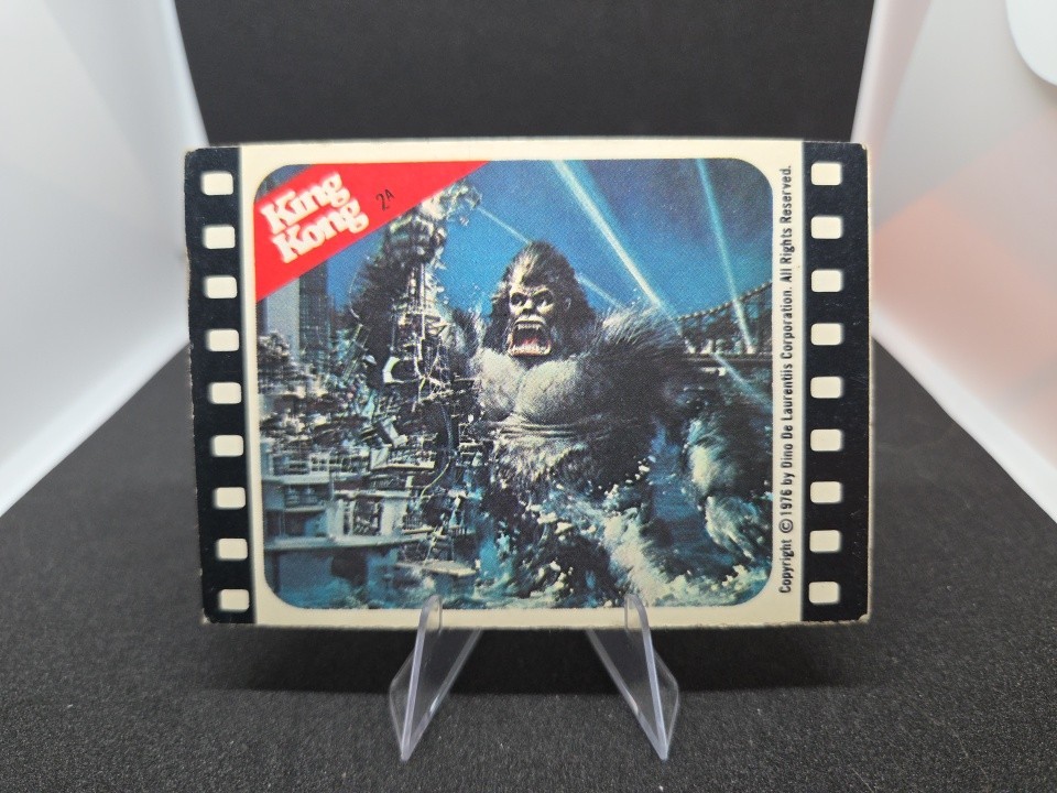1976 Topps King Kong Sticker # 2A Kong In The City Destroying Ship Vintage Movie