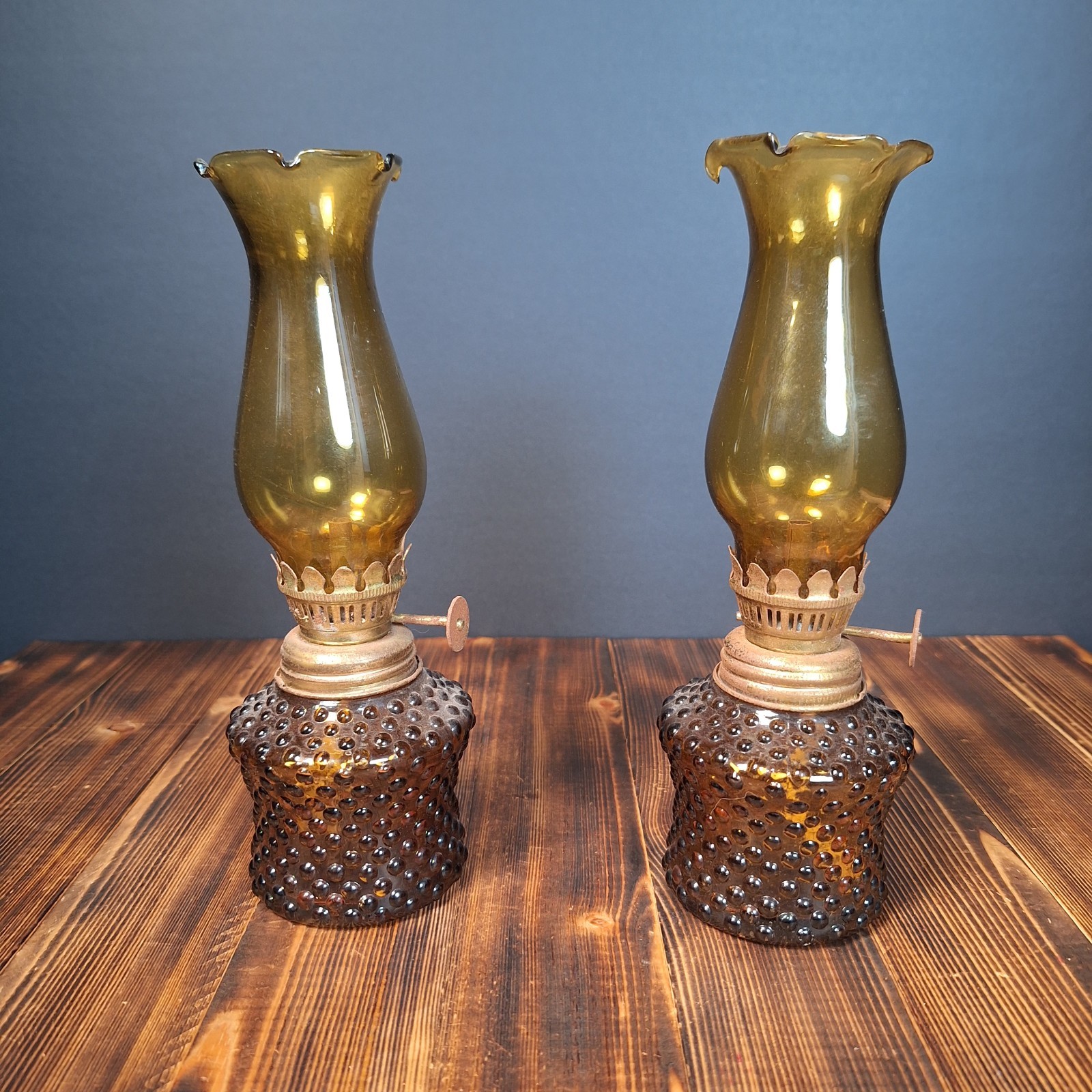 A Pair of Mini Amber Glass Hobnail Design Oil Lamps w/ Crimp Top Amber Globes A Pair of Mini Amber Glass Hobnail Design Oil Lamps w/ Crimp Top Amber Globes
