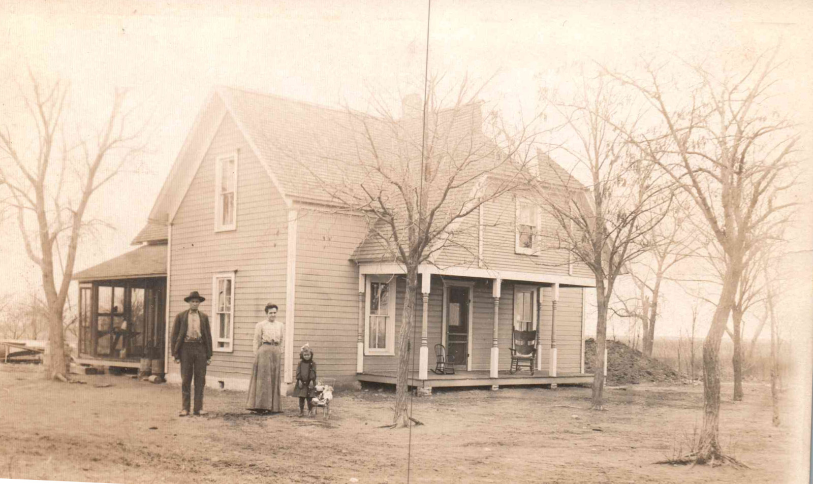 RPPC - Real Photo of a family standing in front of their farmhouse - 1920s RPPC - Real Photo of a family standing in front of their farmhouse - 1920s