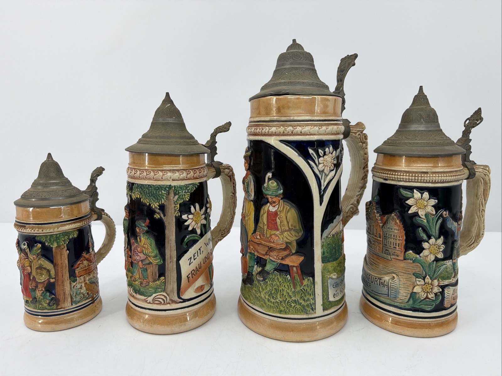 4pc Vintage German Beer Stein Set with Pewter Lids Lot Of 4 4pc Vintage German Beer Stein Set with Pewter Lids Lot Of 4