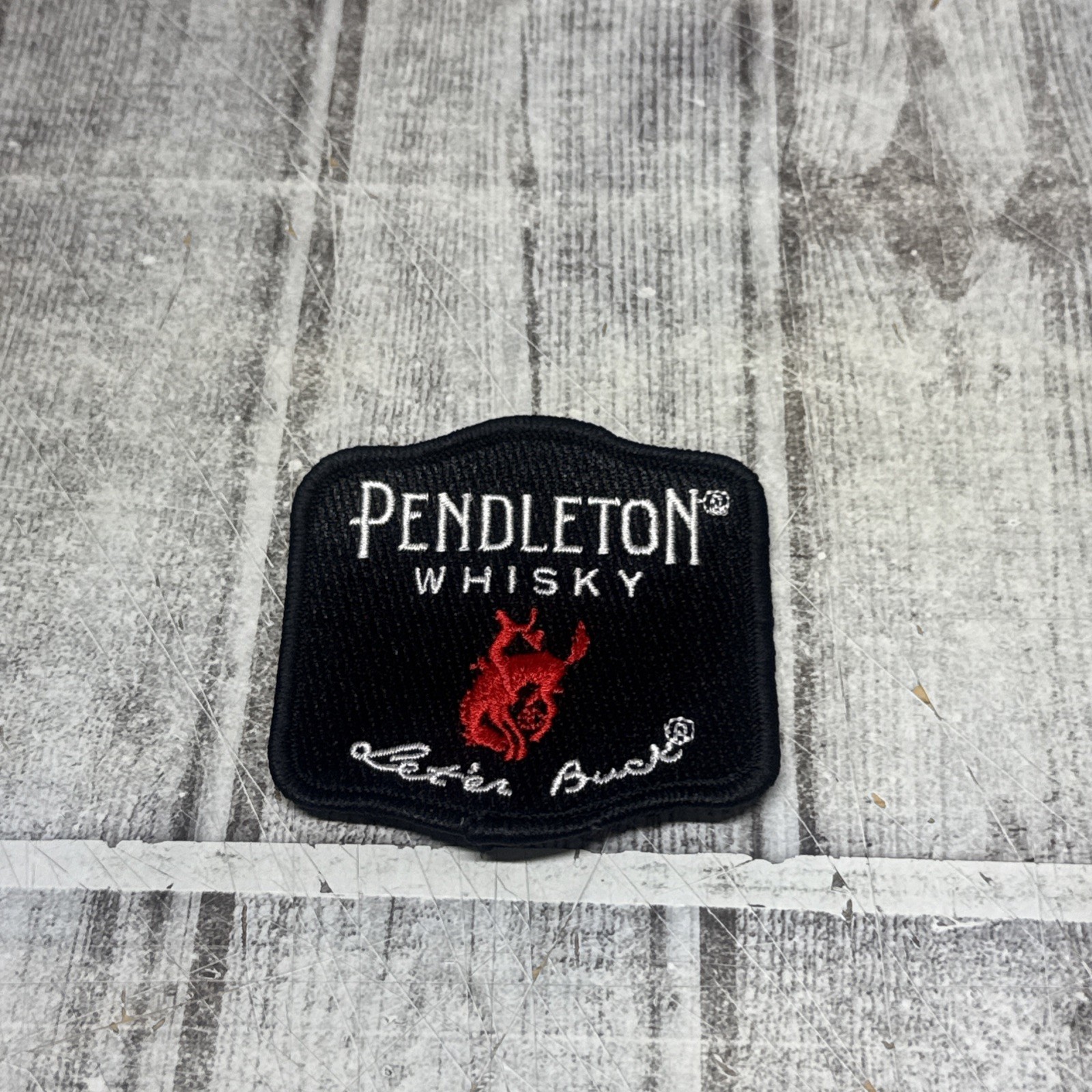 Pendleton Whisky Patch “Let’er Buck” 2.5" Black Red