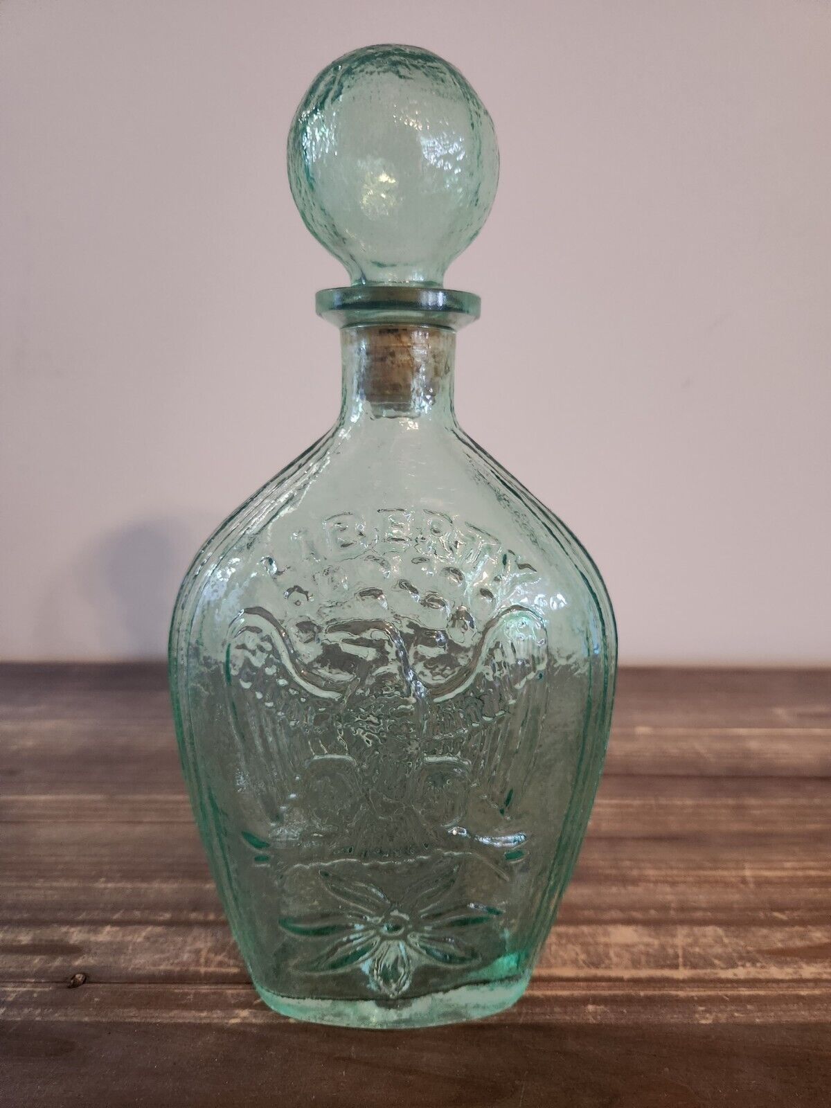 Vintage Liberty Green glass bottle ( from stopper to bottom 11 inches)
