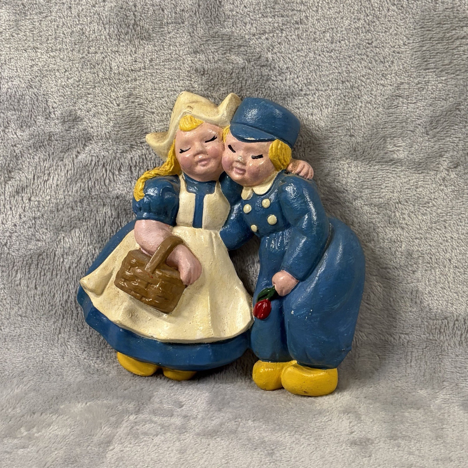 vintage hand-painted chalkware featuring a Dutch boy and girl vintage hand-painted chalkware featuring a Dutch boy and girl
