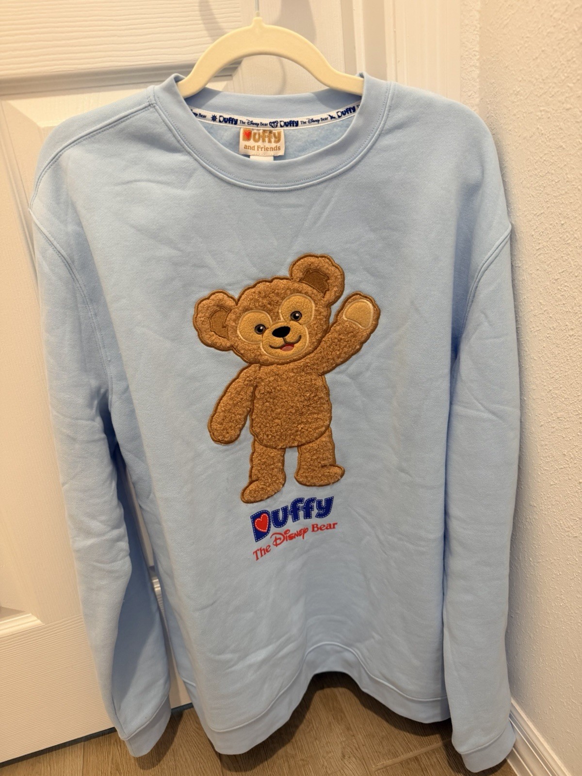Duffy & Friends Disney Duffy the Disney Bear Blue Crewneck Sweatshirt L D23 NWT Duffy & Friends Disney Duffy the Disney Bear Blue Crewneck Sweatshirt L D23 NWT