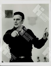 1988 Gerald Arpino captured mid-gesture in a rehearsal space picture