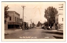 Turtle Lake WI. Main Street 1930s 40s RPPC Dusel Mercantile Leader Dry Goods picture