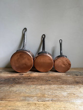 Antique Set of Three Graduated Copper Pans picture
