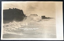 REAL PHOTO DISASTER $25000 HOME BEING WRECKED DURING STORM RPPC POSTCARD picture