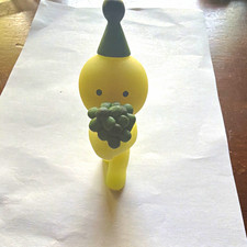 Yellow Smiski Novelty Figurine Holding Gray Bouquet, Black Party Hat, 1-Pack picture