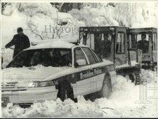 1997 Press Photo Trapped Brookline Police car from ice covered street picture