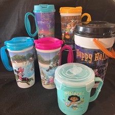 Lot of 6 Disney Parks Souvenir Cups Mugs,Halloween Popcorn Bucket & Enchanto Cup picture