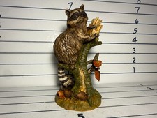 Porcelain Raccoon Procyon lotor Figurine by Stefani sitting on a stump in fall picture