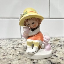 Vintage porcelain figurine of a young girl picture