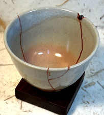 Kintsugi Japanese style repair technique,Hagi Yaki ceramic tea cup, sea glass,VG picture