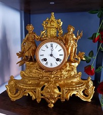 ANTIQUE FRENCH GILT MANTEL CLOCK. picture
