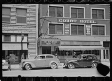 Photo:Court Hotel city street 1935-1942 storefront cars storefronts picture