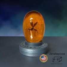Mosquito in Amber With Collectible Jurassic Park Base Dinosaur Fossil Prop picture