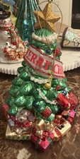 Hand Painted Blown Glass Christmas Tree Ornament Wrapped In A Decorative Banner picture