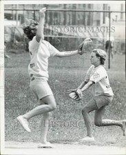 Press Photo Two women go for a ball on a baseball field - nei32106 picture