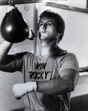 Sylvester Stallone belts punching bag in 1976 Rocky 11x17 inch poster picture