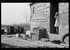 Photo:Depression Era Girl at Shack Industrial Landscape 1930s 1940s picture