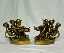 Vintage Pm Crafstmen tug of war book ends picture