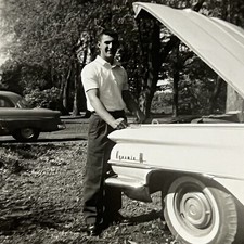Vintage B&W Snapshot Photograph Handsome Young Man Classic Car Hood Up picture