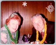 Vtg Color Snapshot Elderly Couple Party Tiara Leis New Year Celebration 1970s picture