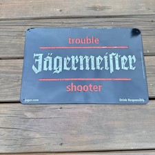 NOS Jagermeister Trouble Shooter Metal Tin Sign Embossed Bar Decor 16x10.5 Black picture