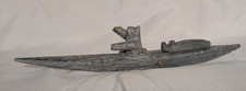 Inuit Eskimo Stone Carving Of Hunter in Canoe With Seal Laying On Bow picture