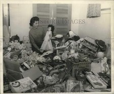 1959 Press Photo Mrs. Glenn Miller admires toys for underprivileged children, LA picture