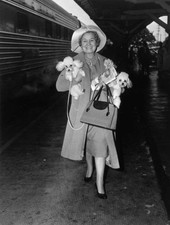 American actor Shirley Booth walking a train platform while carryi- Old Photo picture